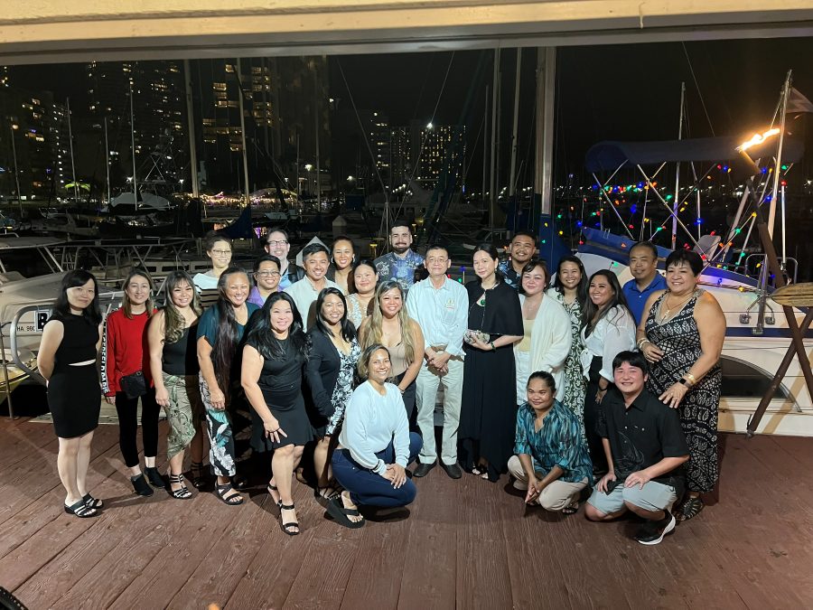The whole team together at an evening gathering by the harbour